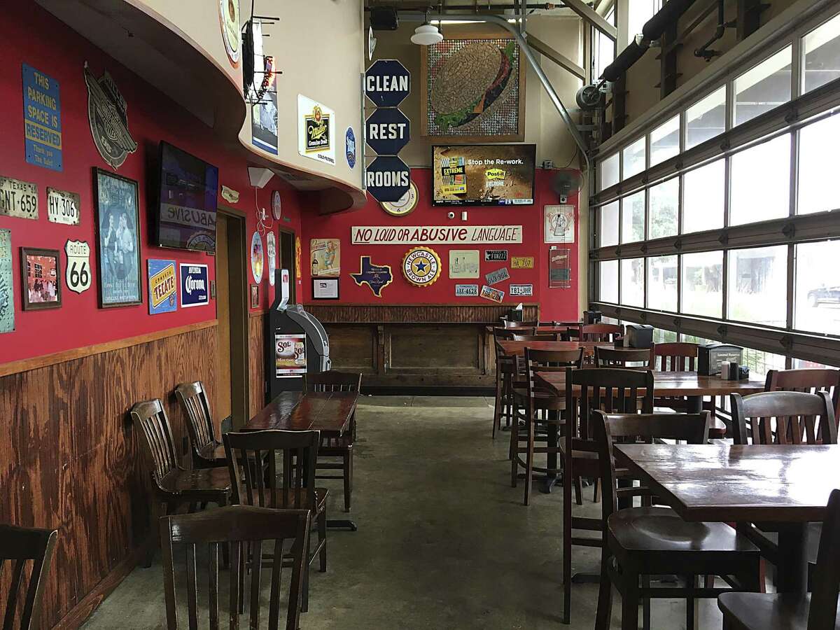 The dining area in front of the bar has a pub atmosphere at Luther's Cafe.