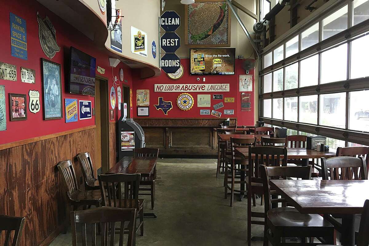 The dining area in front of the bar has a pub atmosphere at Luther's Cafe.
