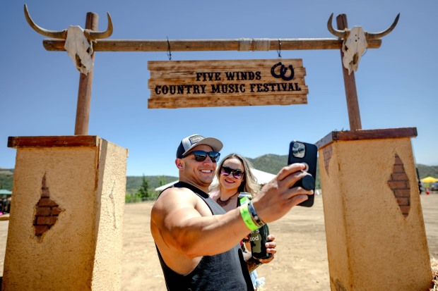 Highlanders Luis Ramos and Cheyenne Flores take selfies...