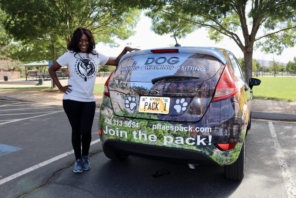 Phae Sunday stands by her car, which features Southern Utah and her business, Ivins, Utah, August 31, 2022 |  Photo by Jessi Bang, St. George News