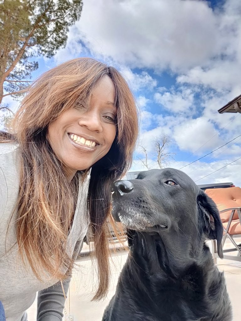 Phae Sunday poses with a dog she cares for via Phae's Pack, location and date not specified |  Photo courtesy of Phae Sunday, St. George News