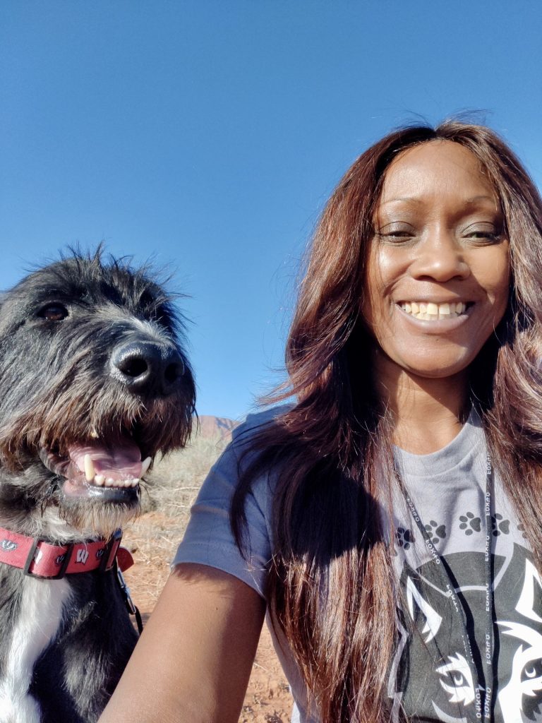 Phae Sunday poses with a dog she cares for via Phae's Pack, location and date not specified |  Photo courtesy of Phae Sunday, St. George News