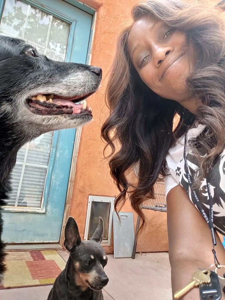 Phae Sunday poses with two dogs she cares for via Phae's Pack, location and date not specified |  Photo courtesy of Phae Sunday, St. George News