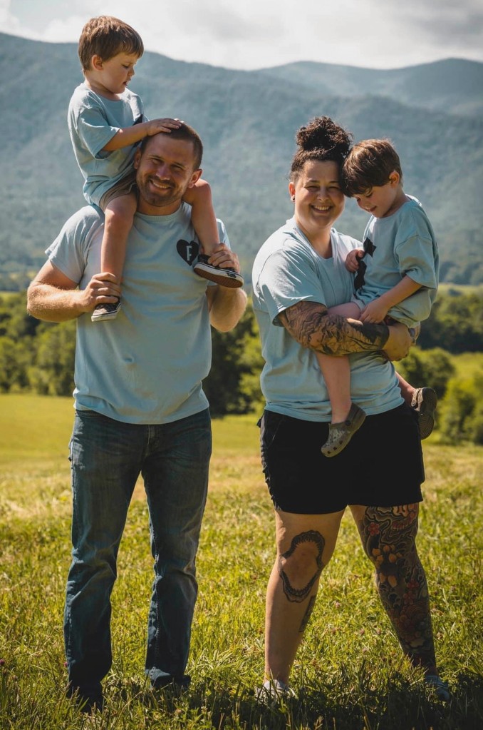 The couple are pictured with their two sons before Nicolette came out.