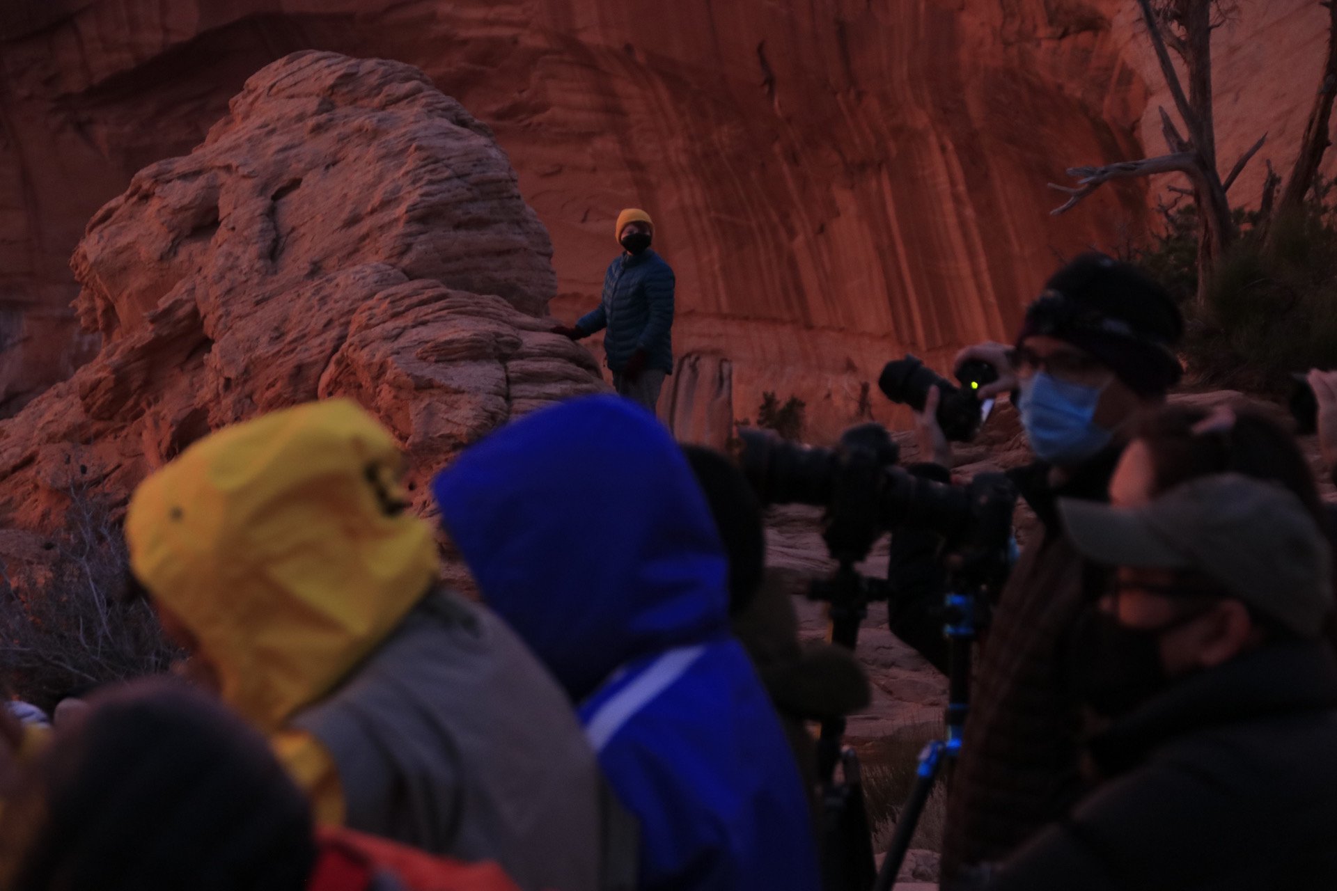 Photographers gather to watch the sunrise at Mesa Arch in Canyonlands National Park